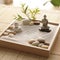 Serenity Zen: A Miniature Zen Garden with Smooth Stones and Raked Sand