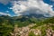 Seriana valley and Orobie Alps with big cloud and blue sky