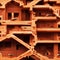 A series of brick sculptures in the shape of a staircase, with ants perched on them