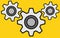 A series of eight teeth grey gear trains mesh bright yellow backdrop