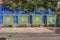 A series of four waste containers
