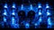 A series of intricate circuit boards illuminated by glowing blue LED lights inside of a hightech audio amplifier