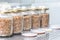 Series of jars with sterile grains for growing edible mushrooms at home