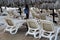 Series of lounge chairs under umbrellas on the beach during daylight