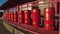 A series of Prayer Wheels of red color. Tibetan Buddhist praying wheels in Elista, Russia. Mantra Om Mani Padme Hum