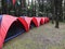 A Series of Six Outdoor Tents on a Camping Ground