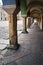 A series of stone columns in the arcades of historic tenement houses