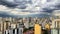 Series SÃ£o Paulo from my window: tropical storm is arriving, sunset on background.