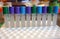 A series of test tubes with reagents ready for use in the laboratory.