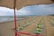 series of umbrellas and deckchairs from the lifeguard watching t