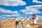 Series of windmills of Consuegra on the hill with blue sky and white clouds (Spain