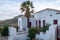 Serifos Island Chora, Cyclades. Greece. Folklore Museum fence and entrance, whitewashed building