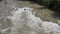 The Serio river swollen after heavy rains. Province of Bergamo, northern Italy. Brown water