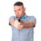 Serious adult man with a beard in a blue bow tie in summer shirt with a firearm in hand in hand aiming