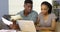 Serious African American couple making bill payments online