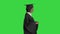 Serious African American female graduate walking with diploma on a Green Screen, Chroma Key.