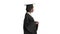 Serious African American female graduate walking with diploma on white background.