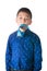 Serious asian boy with necktie in his mouth on the whit