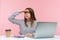 Serious attentive woman office worker looking far away holding hand above head sitting at workplace, seeking for prospects and job