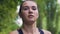 Serious attitude to sport and health, woman runs park , female runner overcomes