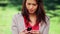 Serious brunette woman texting on her mobile phone