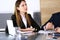 Serious business woman headshot. Asian businesswoman at meeting or negotiation in modern office