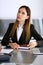 Serious business woman headshot. Asian businesswoman at meeting or negotiation in modern office