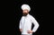 Serious cook in white uniform, chef hat. Portrait of a serious chef cook. Bearded chef, cooks or baker. Bearded male