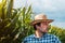 Serious corn farmer portrait in cultivated field