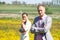 Serious couple in field of wildflowers