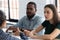 Serious diverse colleagues listen woman team leader during corporate briefing