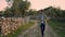 Serious farmer walking summer nature closeup. Nervous man throwing stone outdoor