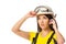 Serious female construction worker in helmet with goggles