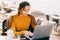 serious Female entrepreneur work on laptop outdoors in cafe