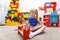 Serious little girl playing and eating banana in daycare