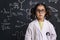 Serious little girl science student with glasses