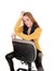 A serious looking woman sitting backwards on office chair