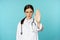 Serious looking young doctor woman, medical clinic worker showing stop, prohibition, forbidding gesture, disapprove smth