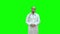 Serious male doctor talking to the camera on a Green Screen, Chroma Key.
