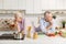 Serious mature loving couple looking at different sides at kitchen.