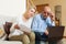 Serious mature man and woman reading finance documents