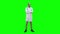 Serious medical worker standing and folding his arms on his chest on a Green Screen, Chroma Key.