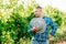 serious modern and young farmer with hat, winery and winemaker