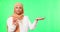 Serious, muslim woman and hand presentation on green screen in studio isolated on a background. Face portrait, palm