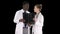 Serious nice woman doctor and afro american doctor study brain x ray, Alpha Channel