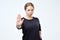 Serious pretty woman making stop hand sign palm gesture