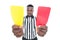 Serious referee showing yellow and red card