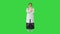 Serious senior physician woman standing with hands crossed on a Green Screen, Chroma Key.