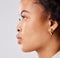 Serious, side profile and face of a black woman isolated on a white background in a studio. Focus, thinking and an