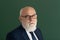 Serious teacher. Closeup portrait of senior academic professor near empty blackboard. Knowledge and traditional